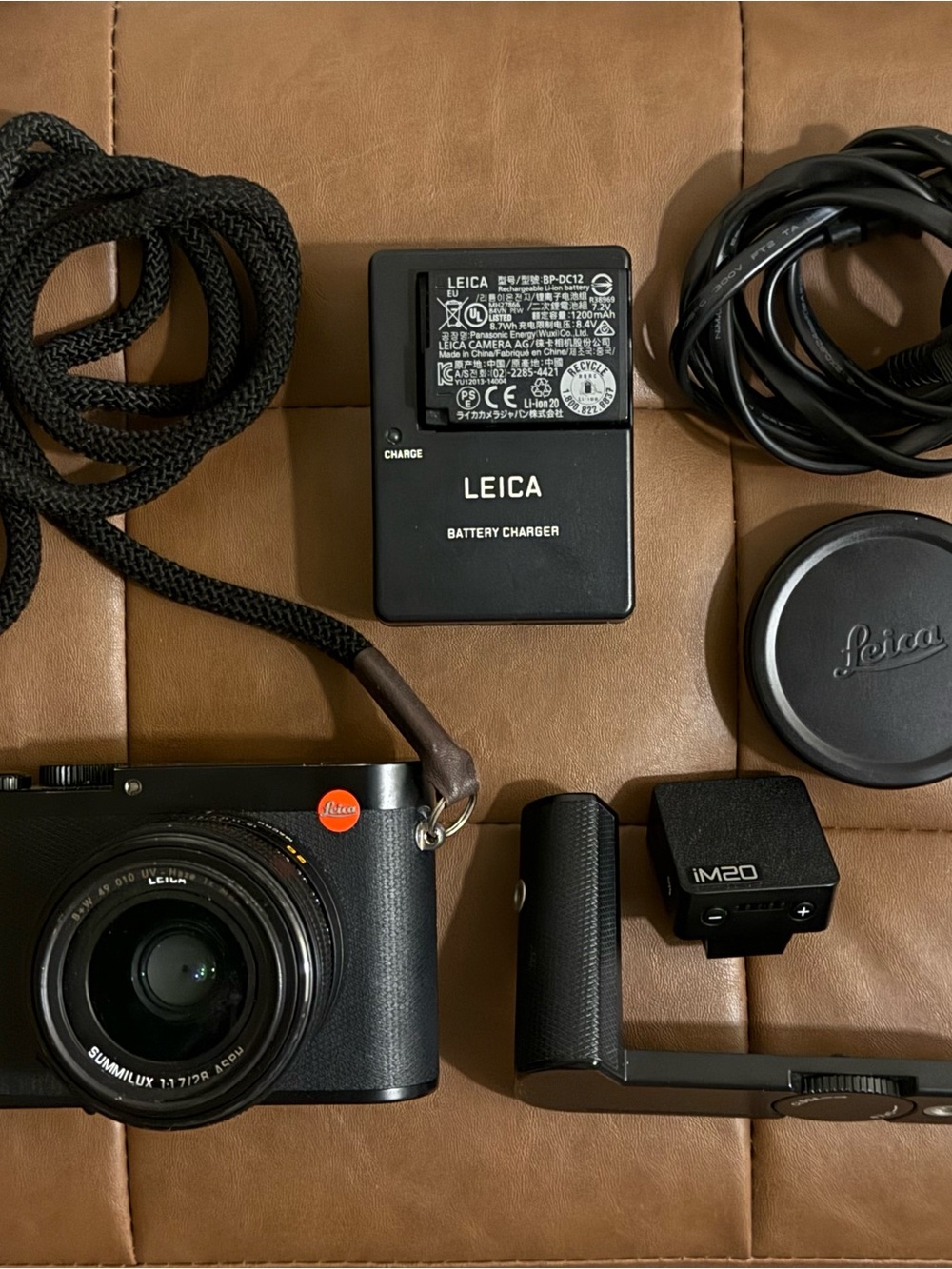 Leica Compact Camera Kit in Black with Brown Strap and Black Accessories